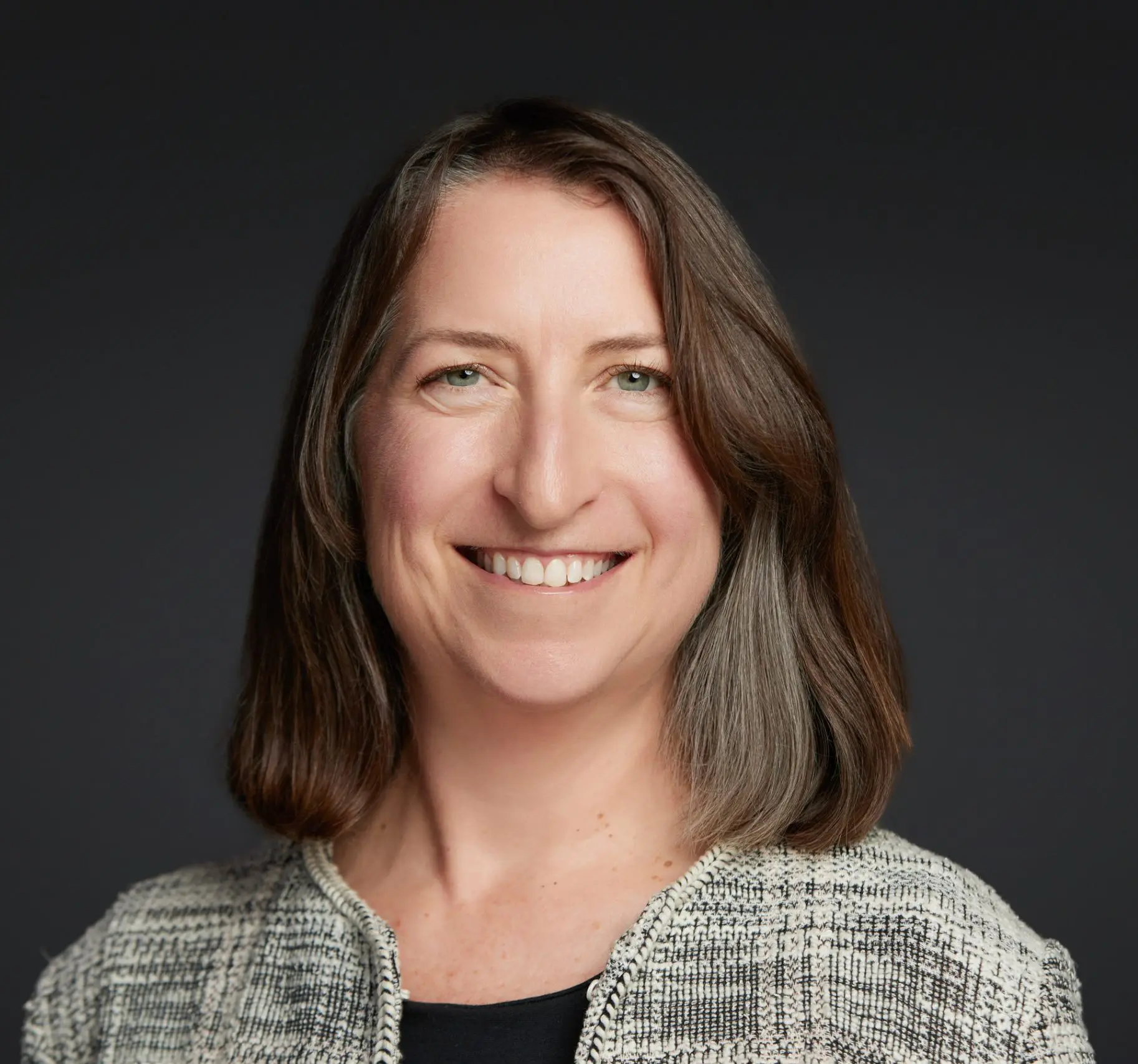 Nona Randois, a white woman with brown shoulder-length hair