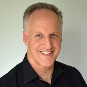 Neil Chase, CEO CalMatters, headshot of middle aged white man in a black shirt