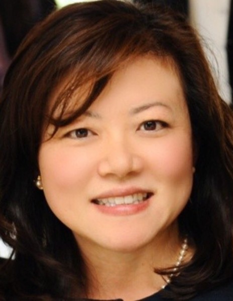 headshot of Elizabeth Kim, a woman of Asian descent with dark hair, wearing pearls and a dark blouse